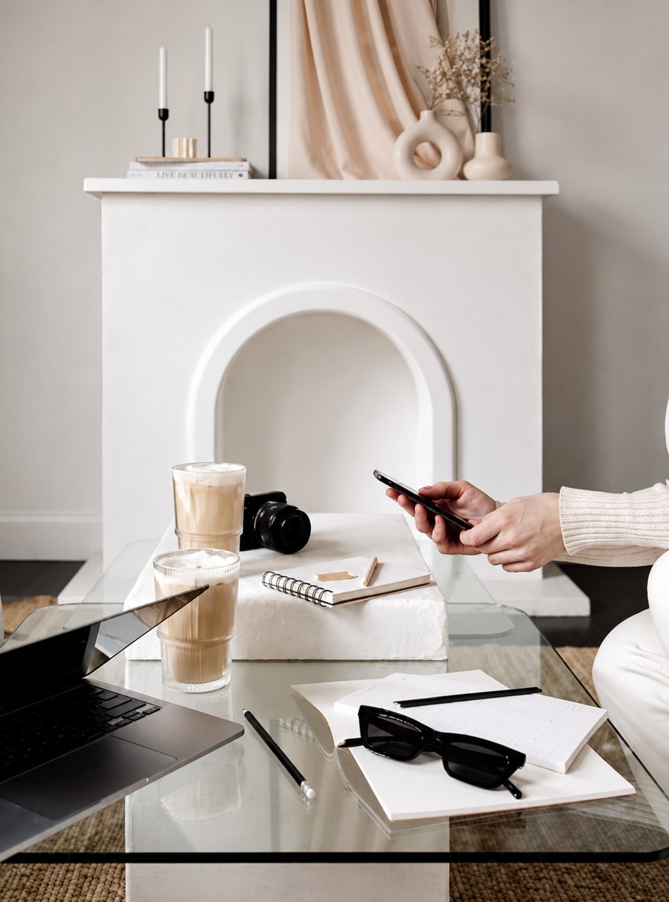 Coffee table styled with glasses and paper goods, linking to The Agency's portfolio