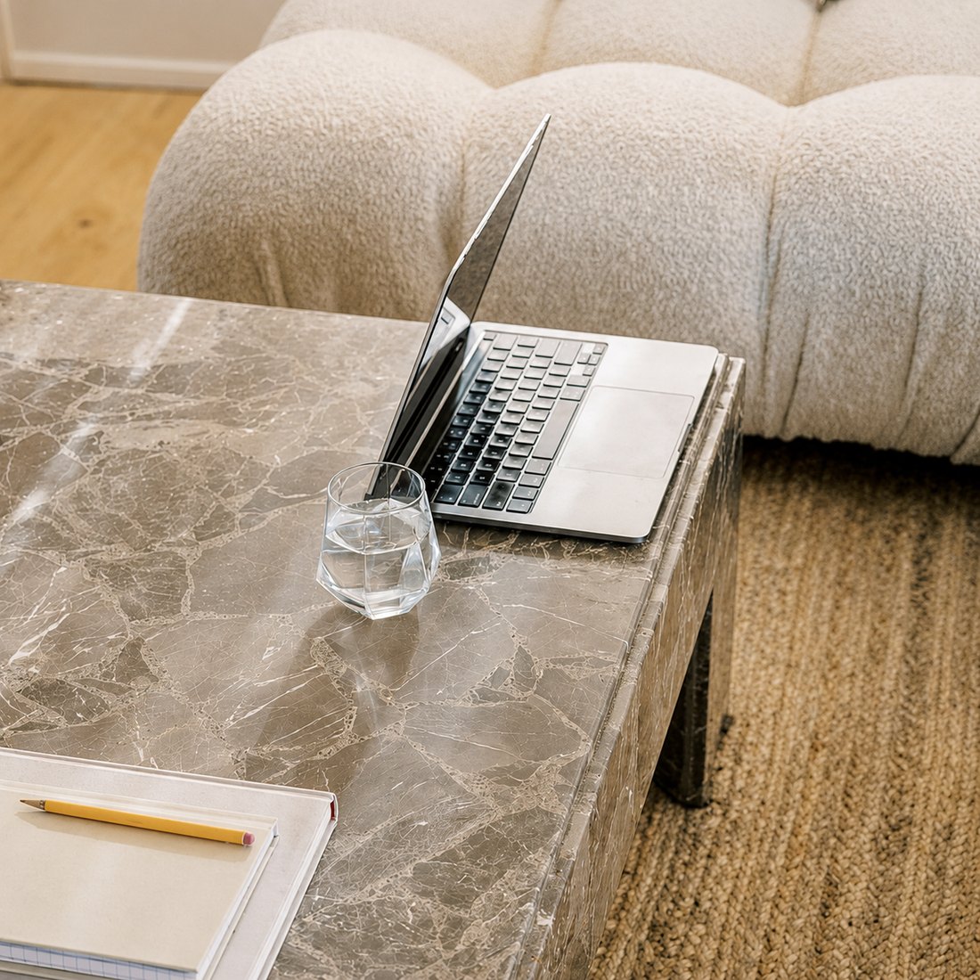 Laptop open on a marble desk in a bright design studio, representing custom website design services from The Agency in Sioux Falls, SD