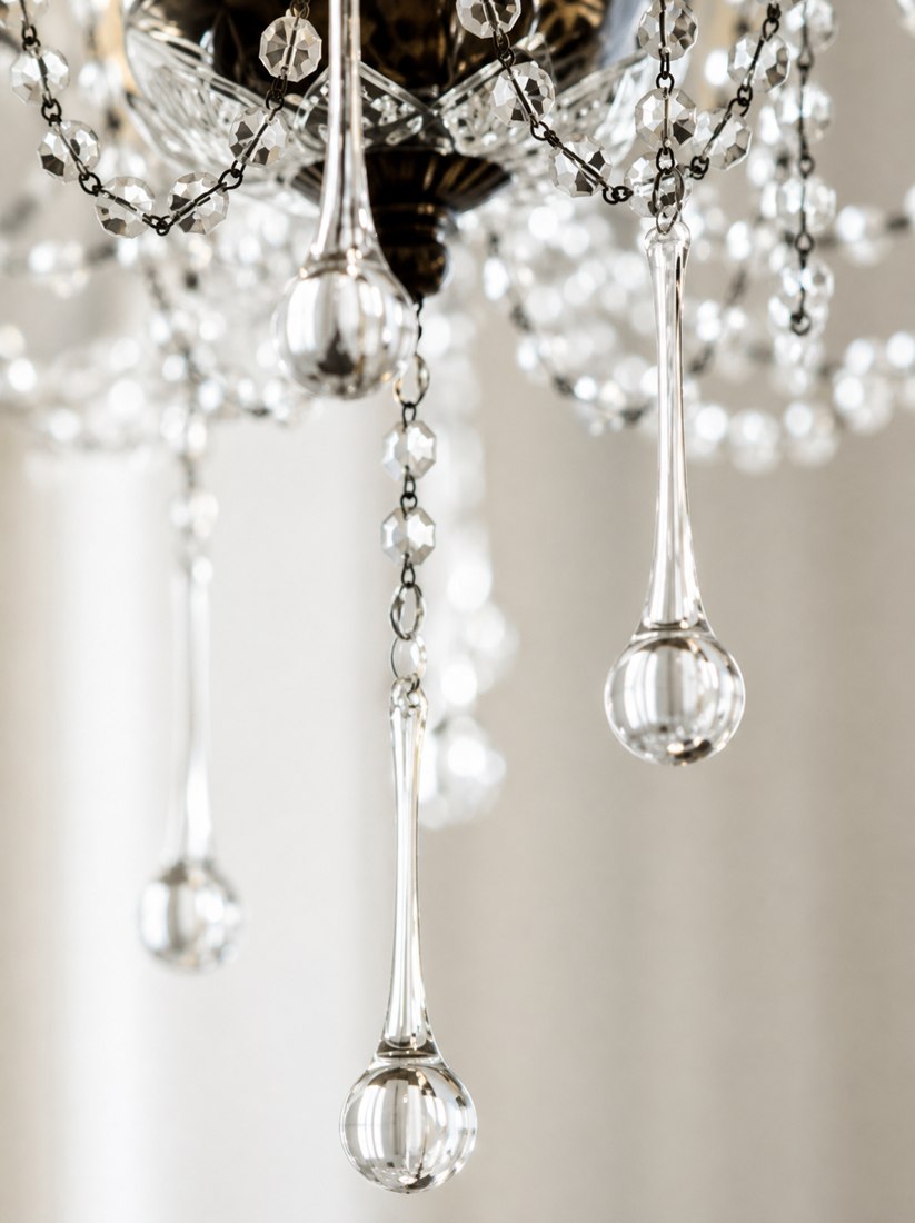 Crystal chandelier detail, an elegant styling accent at The Agency
