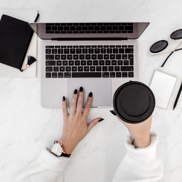 Professional working on a modern web design layout on a computer screen.