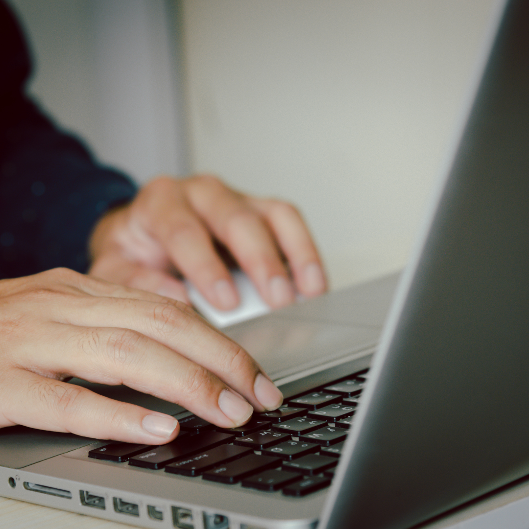 Digital marketing specialist examining an SEO strategy analytics dashboard on a computer screen, debunking common SEO myths.