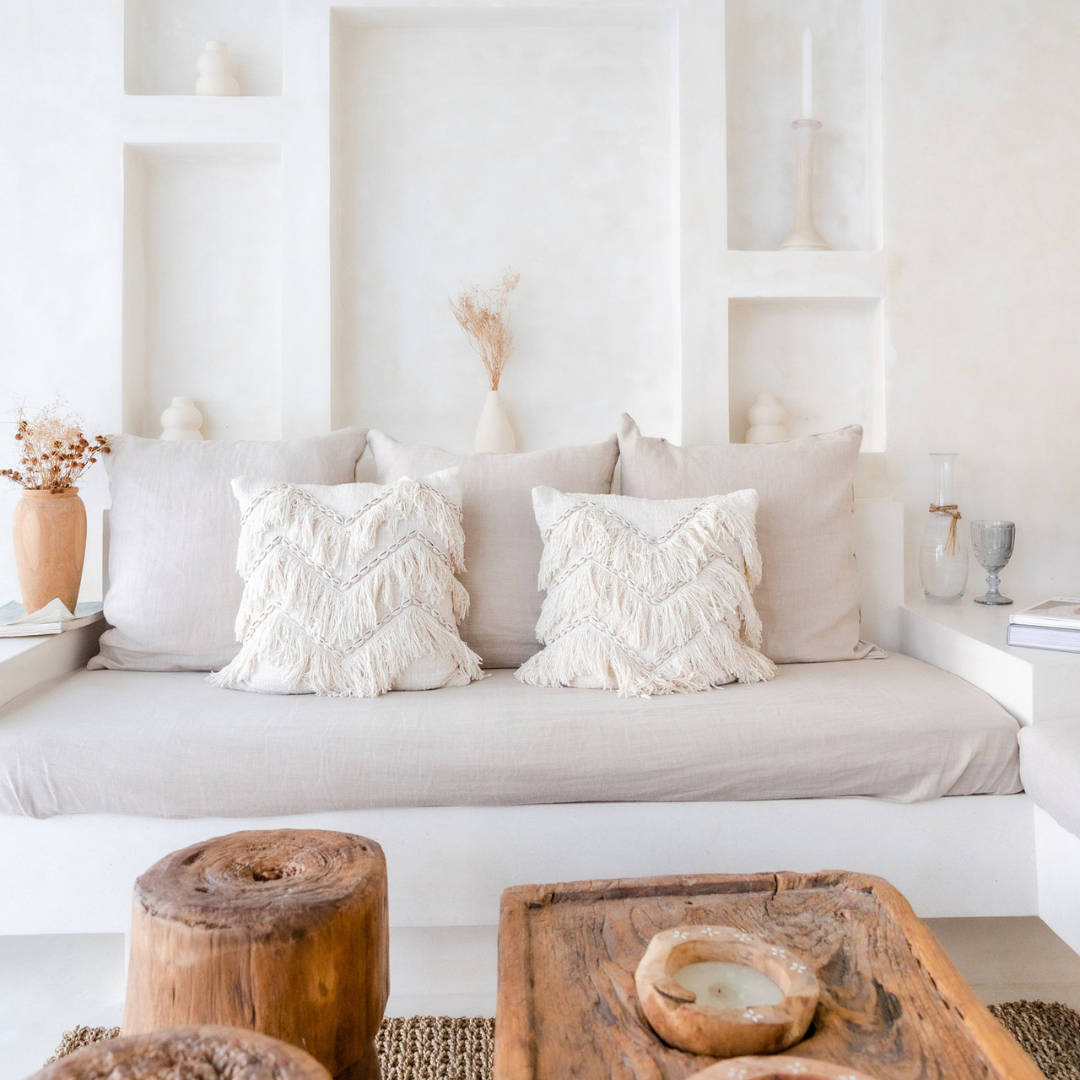 Chic minimalist living room with neutral tones and rustic accents, embodying contemporary real estate luxury.
