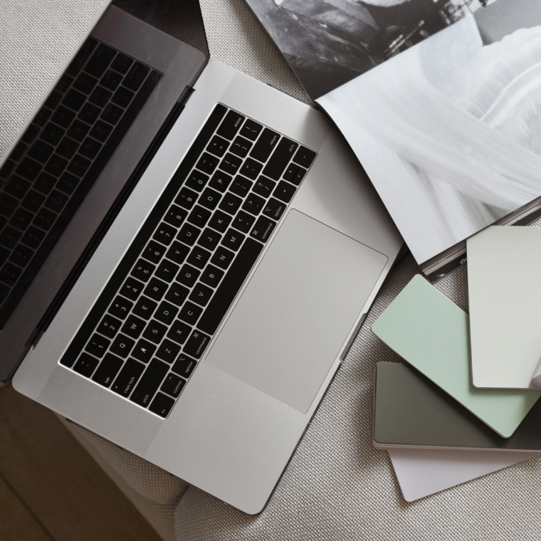 Designer creating a custom website for a boutique on a laptop